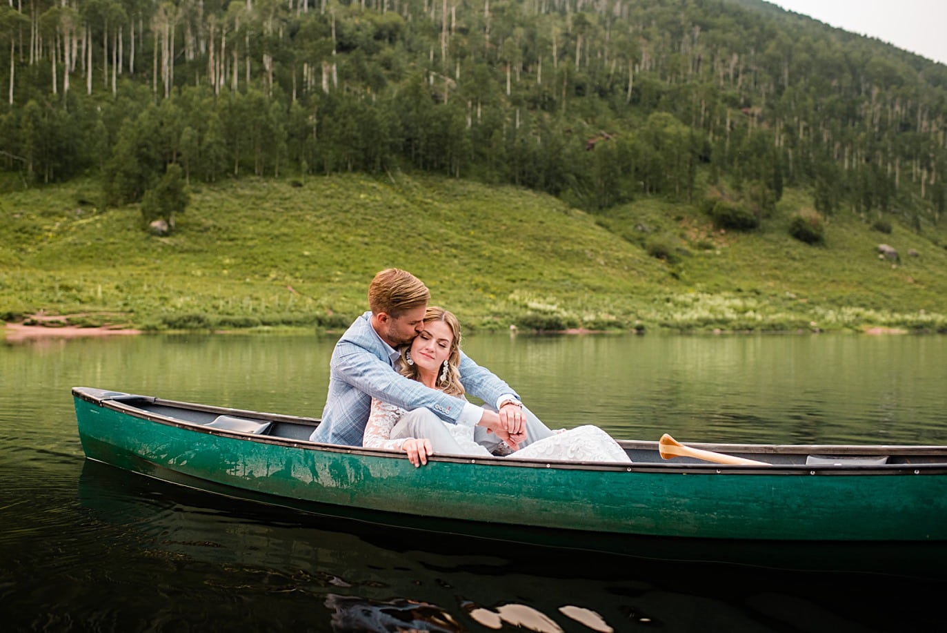 bride and groom in canoe at Piney Lake wedding