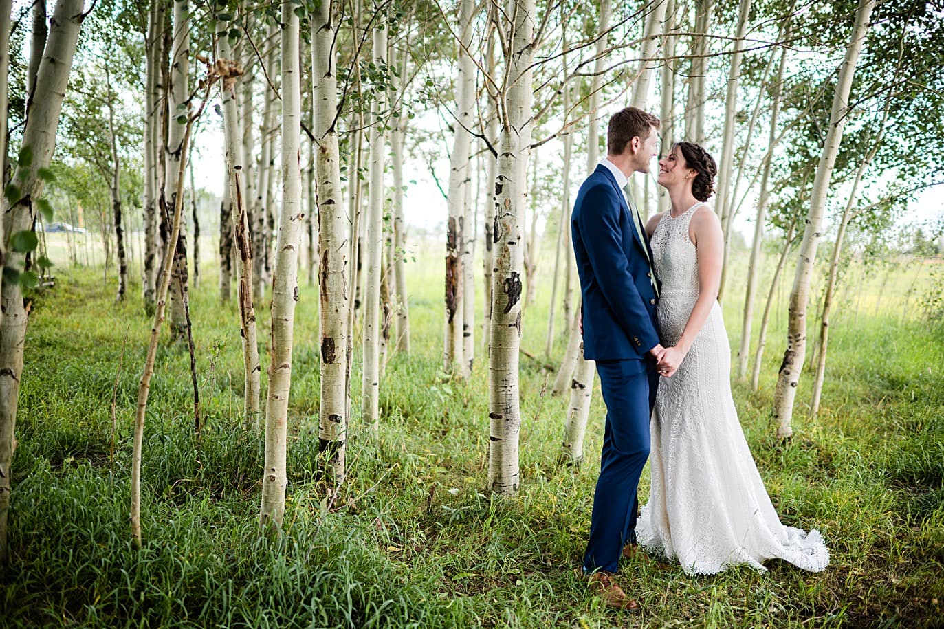 bride and groom in the aspens at a Granby family ranch wedding