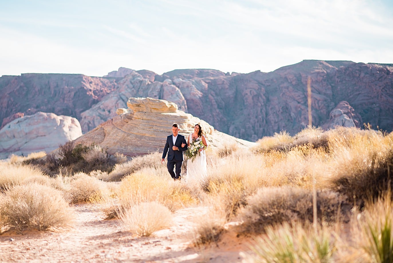 Bride walks down aisle with dad at Valley of Fire Wedding