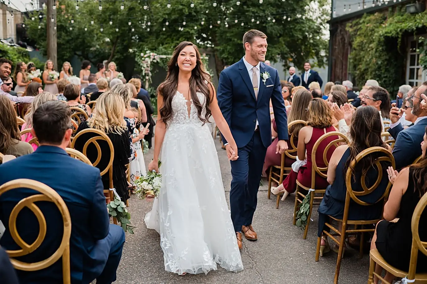 couple walks down the aisle after ceremony at blanc pizza and ice cream party wedding