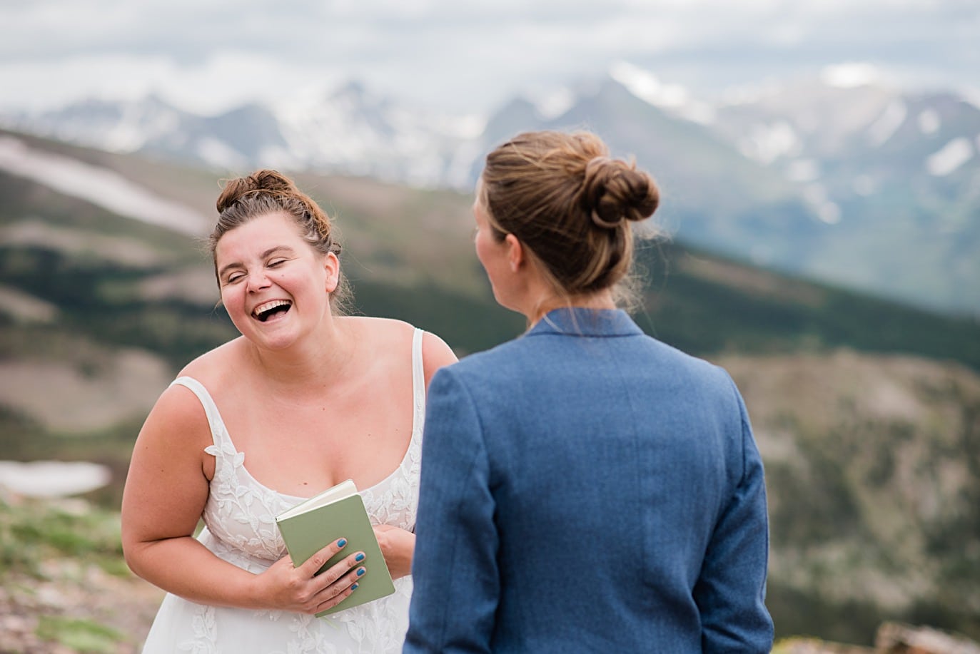 two brides read emotional vows at Breckenridge wedding adventure session