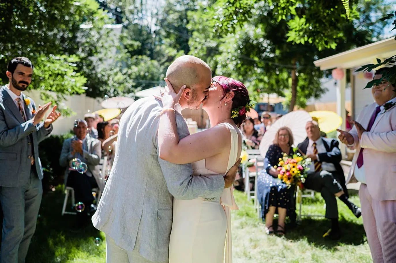 Bride and groom kiss at the end of their ceremony at their Terry Guest House wedding